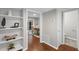 Hallway with built-in shelving leading to dining area and bathroom at 4960 Meadow Ln, Marietta, GA 30068