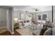 Comfortable living room with hardwood floors, large windows, and backyard patio access at 4960 Meadow Ln, Marietta, GA 30068