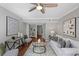 Bright living room showcases modern art, wood floors, and an inviting seating arrangement at 4960 Meadow Ln, Marietta, GA 30068