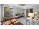 Open concept living area with hardwood floors, stylish furniture, and ample natural light at 4960 Meadow Ln, Marietta, GA 30068