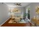 Bright sitting room features hardwood floors, comfortable seating, and natural light at 4960 Meadow Ln, Marietta, GA 30068