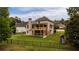 Spacious backyard with deck, screened in patio, wooden fence, and playset at 638 Glen Valley Way, Dacula, GA 30019