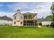 This home boasts an expansive backyard with a two-story screened-in porch perfect for outdoor entertaining at 638 Glen Valley Way, Dacula, GA 30019