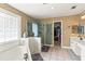 Spacious bathroom with a glass enclosed shower, soaking tub and walk in closet at 638 Glen Valley Way, Dacula, GA 30019