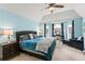 Spacious primary bedroom features a seating area, fireplace and lots of natural light at 638 Glen Valley Way, Dacula, GA 30019