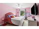 Bright pink bedroom featuring a window, tv, carpet and a cute bed at 638 Glen Valley Way, Dacula, GA 30019
