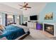 Well-lit primary bedroom with ensuite bathroom, fireplace and stylish decor at 638 Glen Valley Way, Dacula, GA 30019
