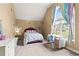 Bedroom featuring a large window, desk, purple accents and great natural light at 638 Glen Valley Way, Dacula, GA 30019