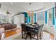 Bright dining room featuring modern chandelier, hardwood floors, and neutral color palette at 638 Glen Valley Way, Dacula, GA 30019