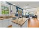 Eat-in kitchen featuring stainless appliances, granite counters and hardwood floors at 638 Glen Valley Way, Dacula, GA 30019