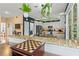 Eat-in kitchen features stainless appliances, island, granite countertops, breakfast bar and hanging plants at 638 Glen Valley Way, Dacula, GA 30019