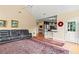 Bright living room featuring vaulted ceiling, hardwood floors and area rug at 638 Glen Valley Way, Dacula, GA 30019