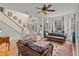 Inviting living room with high ceilings, hardwood floors, staircase, and plenty of natural light at 638 Glen Valley Way, Dacula, GA 30019