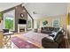 Spacious living room with a fireplace, large windows, and comfortable seating area with a leather sectional at 638 Glen Valley Way, Dacula, GA 30019