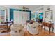 Inviting living area featuring hardwood floors, natural light, and an open layout connecting to the dining room at 638 Glen Valley Way, Dacula, GA 30019