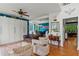 Inviting living area featuring hardwood floors, natural light, and an open layout connecting to the dining room at 638 Glen Valley Way, Dacula, GA 30019