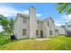 View of the home's backyard, a green lawn, a patio and a chimney are featured at 6799 Hill Creek Cv, Lithonia, GA 30058