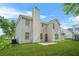 The back of a home with a well-manicured lawn, patio, chimney, and white siding at 6799 Hill Creek Cv, Lithonia, GA 30058