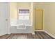 Bright bathroom featuring a soaking tub and walk-in shower at 6799 Hill Creek Cv, Lithonia, GA 30058