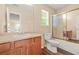 Well-lit bathroom featuring a vanity, toilet, and a shower with sliding glass doors at 6799 Hill Creek Cv, Lithonia, GA 30058