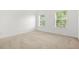 Bedroom with carpet and windows at 6799 Hill Creek Cv, Lithonia, GA 30058