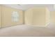 Bright bedroom with neutral carpeting, a large window and ample space for customization at 6799 Hill Creek Cv, Lithonia, GA 30058