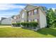 Beautiful two-story home with brick facade, red shutters, and manicured landscaping at 6799 Hill Creek Cv, Lithonia, GA 30058
