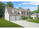 Brick home on a large lot with a two car garage and traditional shutters on the windows at 6799 Hill Creek Cv, Lithonia, GA 30058
