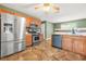 Modern kitchen with stainless steel appliances, wooden cabinets, and attractive backsplash, a chef's delight at 6799 Hill Creek Cv, Lithonia, GA 30058
