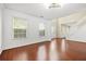 Bright living room with hardwood floors, large windows, and neutral wall colors at 6799 Hill Creek Cv, Lithonia, GA 30058