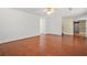 Spacious living room with beautiful hardwood floors, providing an elegant and comfortable atmosphere at 6799 Hill Creek Cv, Lithonia, GA 30058