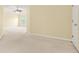 A vast main bedroom featuring neutral carpeting, a ceiling fan, and adjoining spaces at 6799 Hill Creek Cv, Lithonia, GA 30058