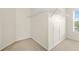 Spacious walk-in closet featuring wire shelving and natural light at 6799 Hill Creek Cv, Lithonia, GA 30058