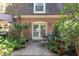 Charming backyard patio surrounded by lush greenery and a brick wall, perfect for outdoor relaxation at 1261 Lavista Ne Rd # M-4, Atlanta, GA 30324