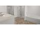 Bathroom with double vanities, walk-in shower, and soaking tub at 1400 Gray Branch Dr, Lawrenceville, GA 30045
