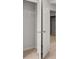 A closet with an open door showing a wire shelf in an empty closet with neutral carpet at 1400 Gray Branch Dr, Lawrenceville, GA 30045