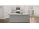 Beautiful kitchen island featuring granite countertops and modern appliances at 1400 Gray Branch Dr, Lawrenceville, GA 30045