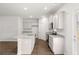 Open-concept kitchen boasts granite countertops and stainless steel appliances at 1400 Gray Branch Dr, Lawrenceville, GA 30045