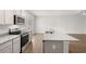 Modern kitchen with stainless steel appliances, granite countertops and island at 1400 Gray Branch Dr, Lawrenceville, GA 30045