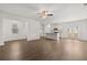 Open-concept kitchen and living room with hardwood floors, stainless steel appliances, and bright windows at 1400 Gray Branch Dr, Lawrenceville, GA 30045