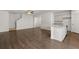 Bright open-concept living area with hardwood floors, kitchen island, and ample space at 1400 Gray Branch Dr, Lawrenceville, GA 30045
