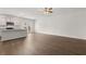 Open concept living area with hardwood floors flowing into a modern kitchen space at 1400 Gray Branch Dr, Lawrenceville, GA 30045