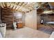 A basement bathroom features a vanity, toilet, and unique wood wall design at 194 Lake Ruby Dr, Suwanee, GA 30024