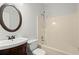 Bathroom with vanity, mirror, toilet, and shower-tub combo at 194 Lake Ruby Dr, Suwanee, GA 30024