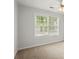Bedroom with a large window providing natural light at 194 Lake Ruby Dr, Suwanee, GA 30024
