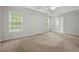 Bright bedroom featuring neutral walls, two windows, and a ceiling fan at 194 Lake Ruby Dr, Suwanee, GA 30024