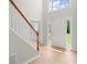 Bright foyer with tile flooring, staircase, and natural light streaming through the windows at 194 Lake Ruby Dr, Suwanee, GA 30024