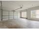 Spacious two car garage with an automatic garage door, concrete floor, and plenty of storage space at 194 Lake Ruby Dr, Suwanee, GA 30024