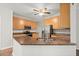 Well-lit kitchen featuring granite countertops, stainless steel appliances, and light wood cabinetry at 194 Lake Ruby Dr, Suwanee, GA 30024