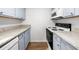 Galley style kitchen featuring granite counters and stainless steel appliances at 382 Northdale Ct, Lawrenceville, GA 30046